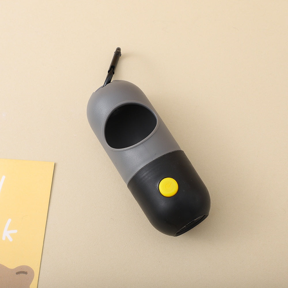Black grey LED dog poo bag dispenser clipped to a bag