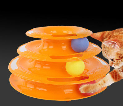 Cat batting spinning balls on multi-layer track tower