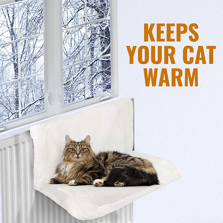 Cosy cat curled up in radiator hammock bed