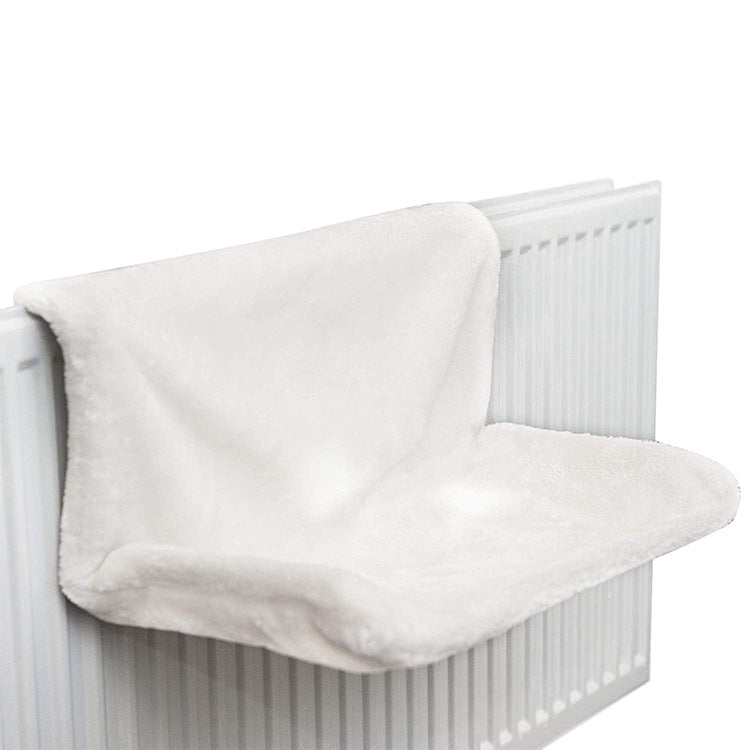 Hanging iron-frame cat bed over a radiator