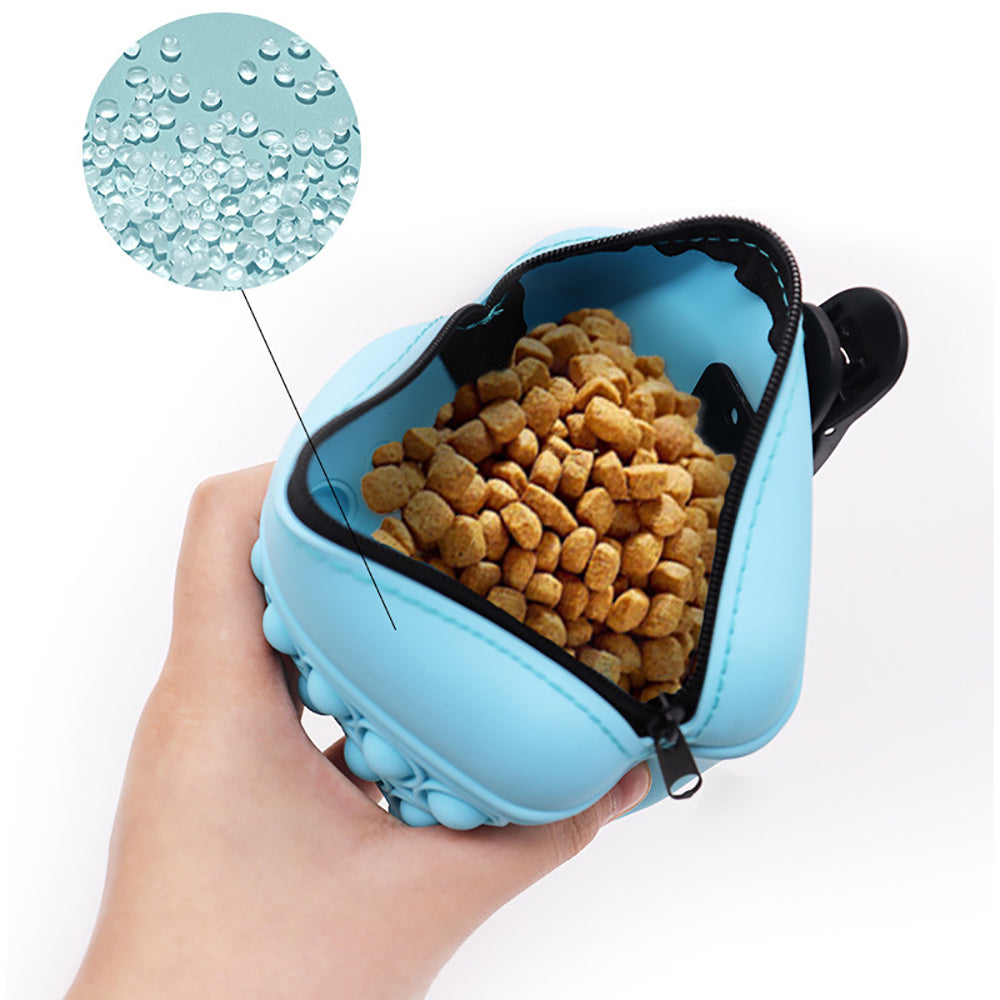 Dog treat pouch clipped to a belt for hands-free training