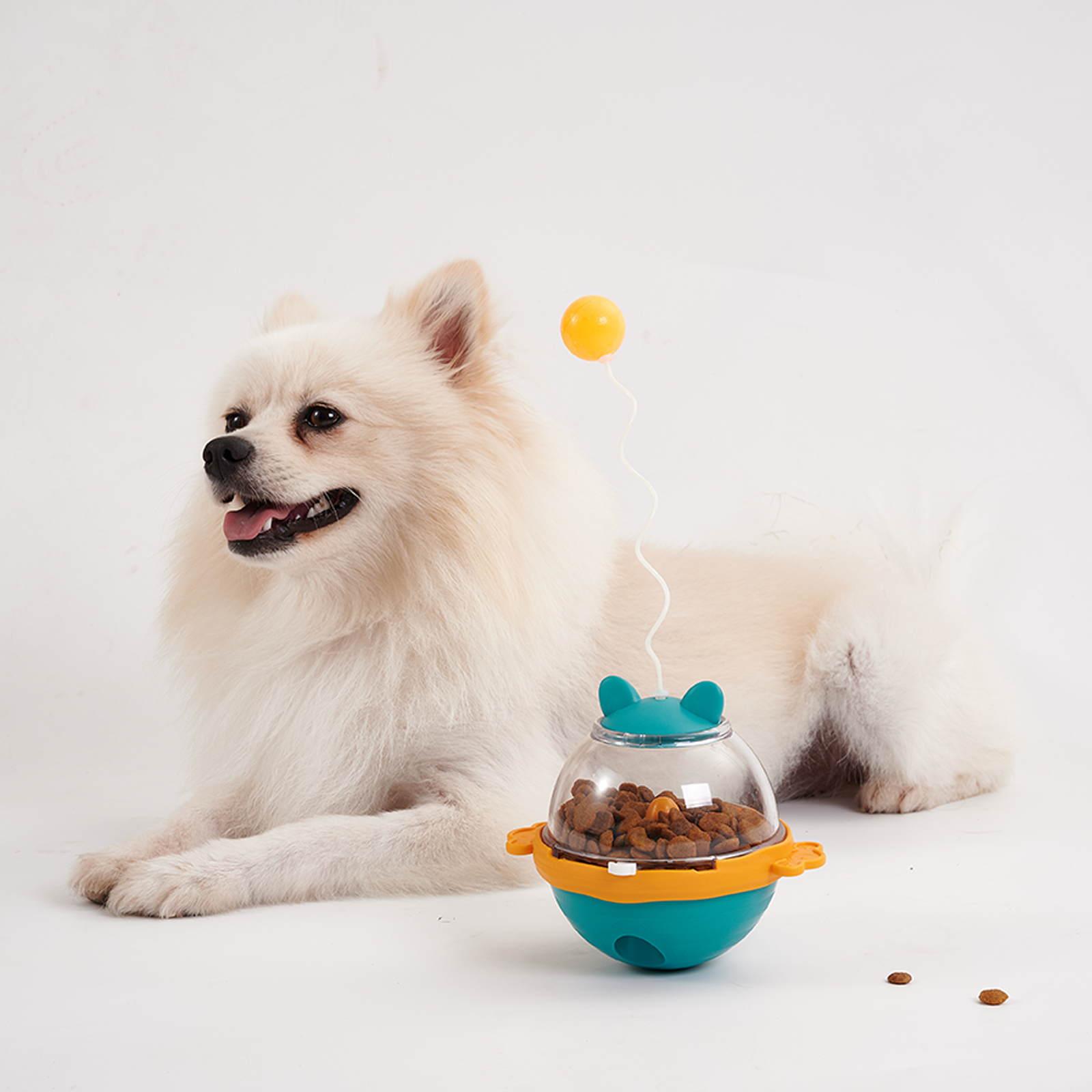 Self-righting treat dispenser tumbler releasing kibble